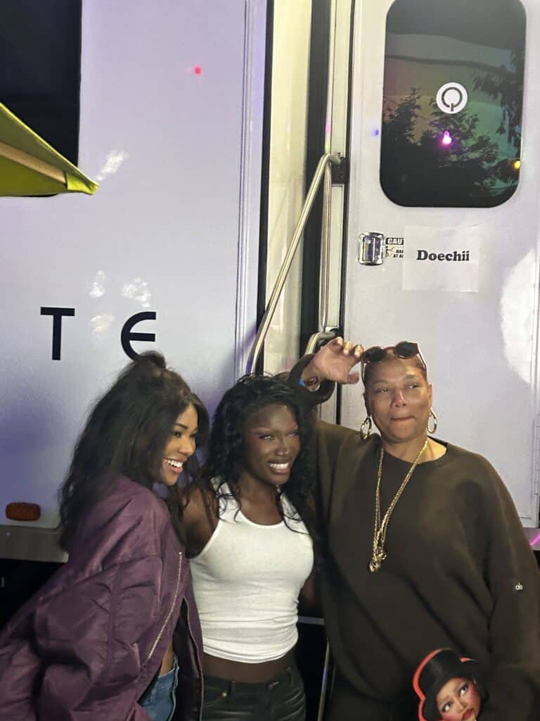 Gabrielle Union, Doechii, and Queen Latifah smiling together and posing for photos outside of Doechii’s trailer. Credit: Blossom Brown