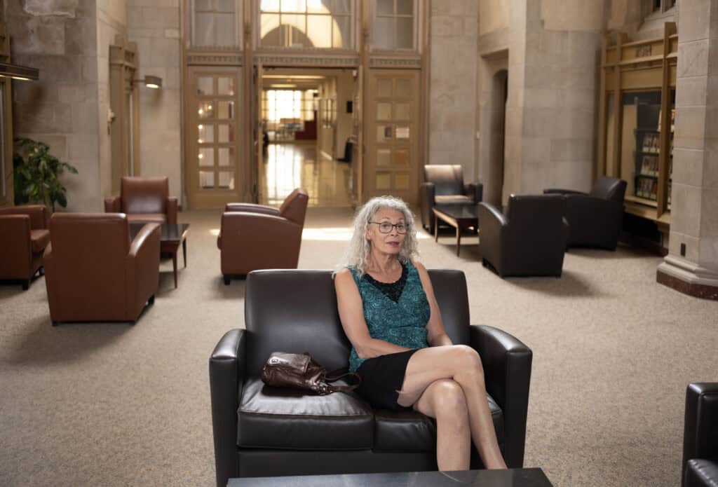 Vera Verbel in the lobby of the College of Law at Northern Illinois University. 