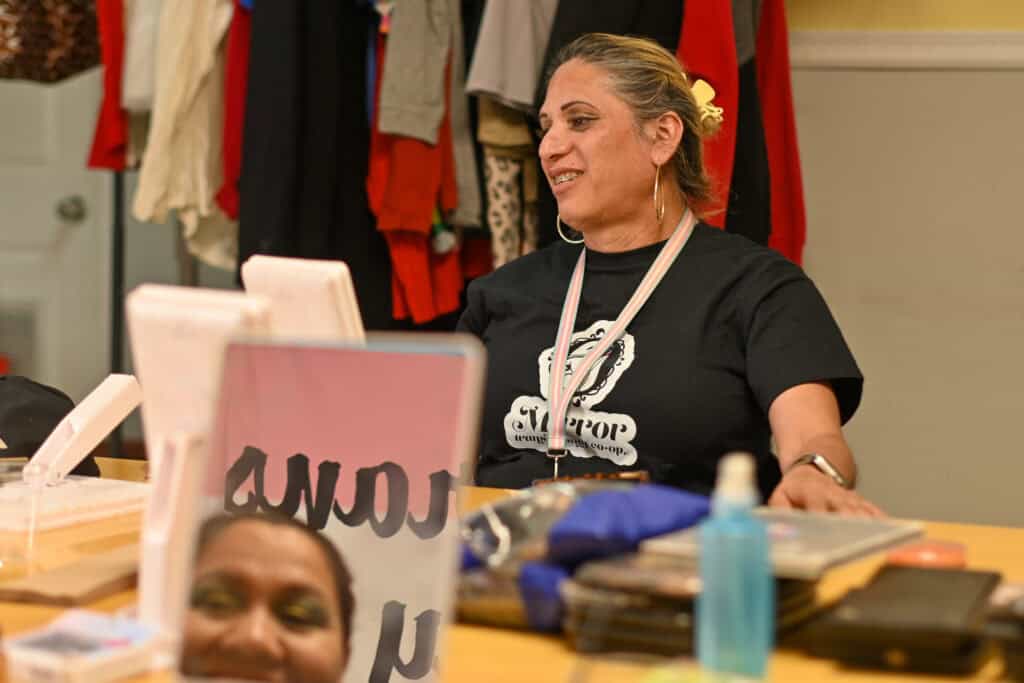 Joselyn Mendoza smiling as she sits at a table.